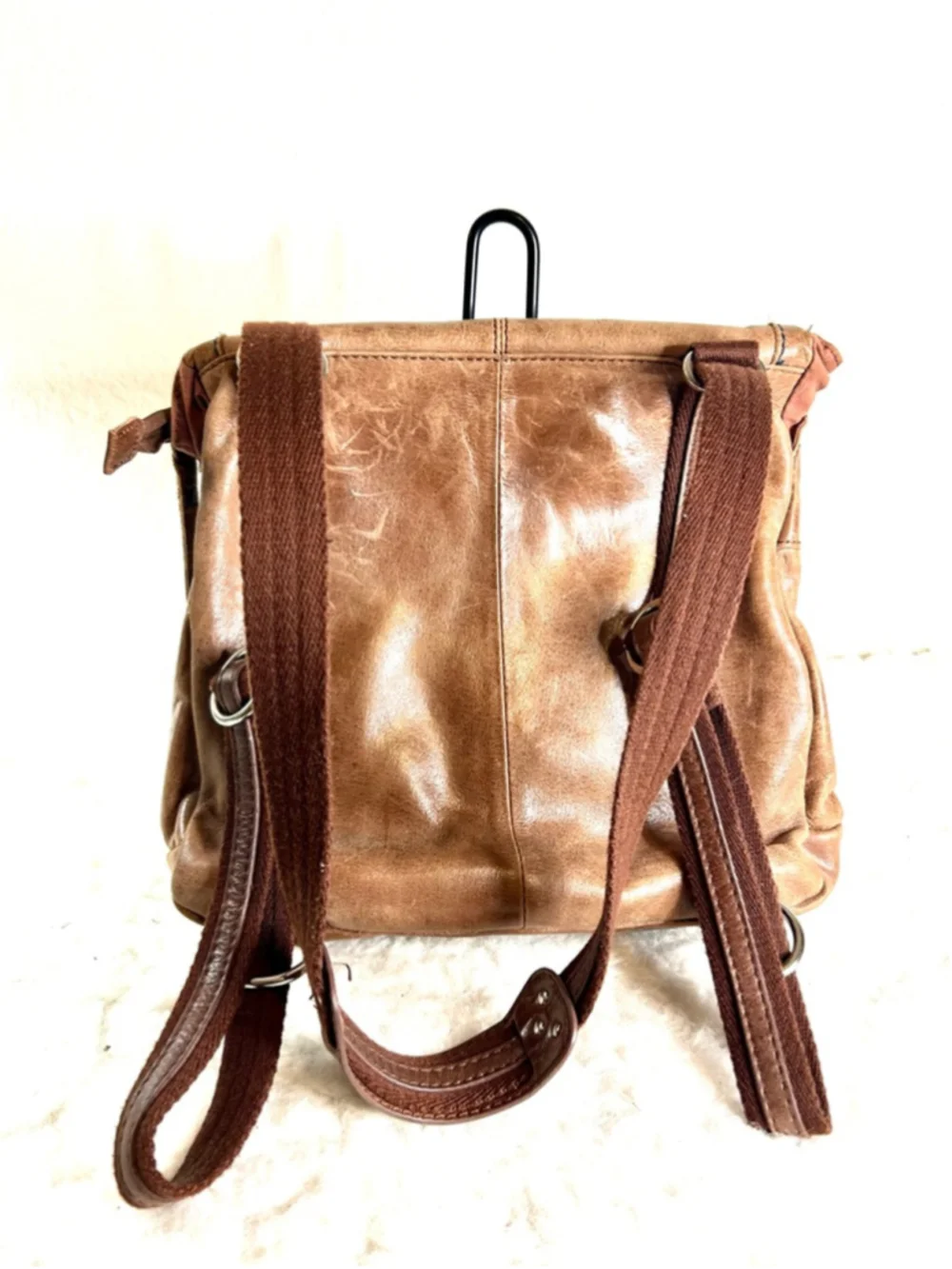 The Sak Ventura Leather Convertible Backpack in a brown, distressed leather